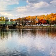 Bridge over Delaware River backdropped by fall foliage in New Hope, PA